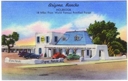 Illustrated postcard of Arizona Rancho in Holbrook, with vintage cars parked outside a white adobe-style building and trees in the background. Text notes location and distance from Petrified Forest.