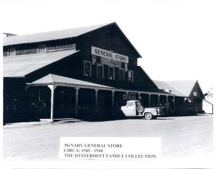Black and white photo of the McNary General Store, circa 1945-1948, with a vintage pickup truck parked in front.